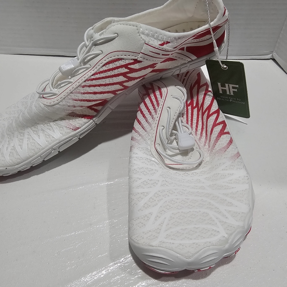 White and Red Athletic Shoes